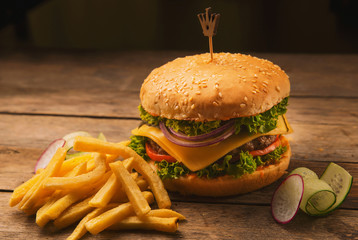 cheeseburger with spices and crispy French fries