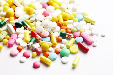 Colorful pills on a white background