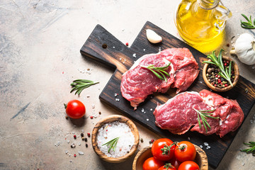 Fototapeta na wymiar Raw beef steak rib eye with herbs.