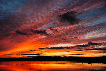 Fototapeta premium Sunset landscape upon the river