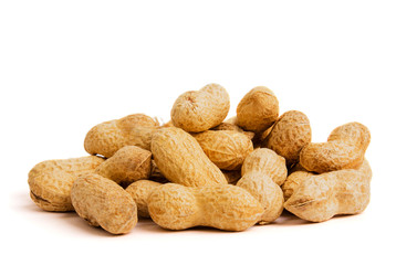 Heap of peanuts as background. Macro view of shelled peanuts.