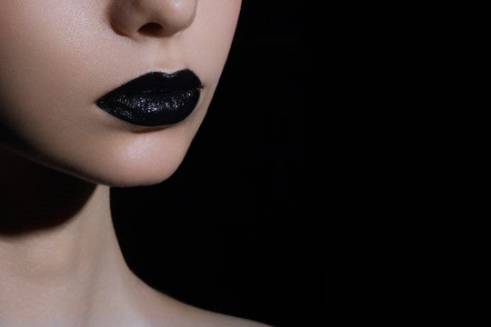 Glamour black gloss lips with sensuality gesture.