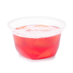 Cup of jelly with fruit red peach isolation
