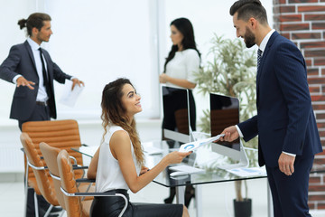 Manager handing the employee the document