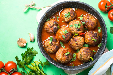 Meatballs in tomato sauce in a frying pan top view. 