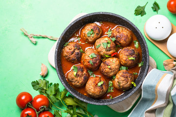 Meatballs in tomato sauce in a frying pan top view. 