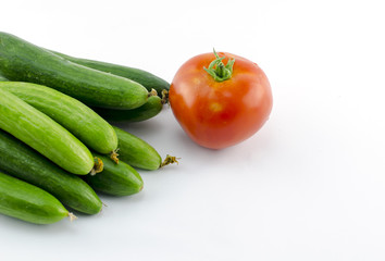 Red tomatoes and green cucumbers