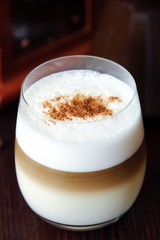 Delicious coffee latte with cinnamon in a glass 