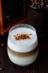 Delicious coffee latte with cinnamon in a glass 