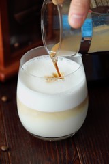 Delicious coffee latte with cinnamon in a glass 