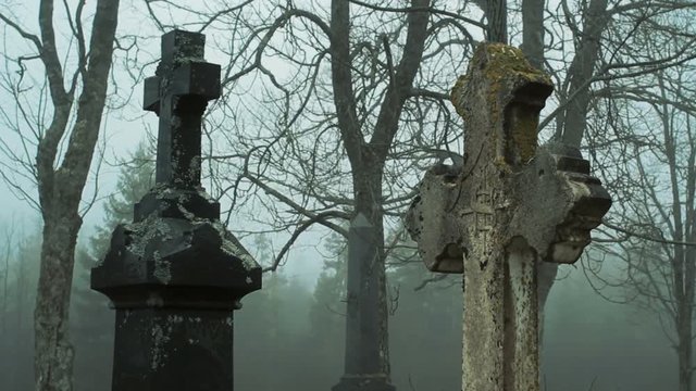 Cinematic style footage of cemetery tombstones