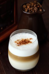 Delicious coffee latte with cinnamon in a glass 