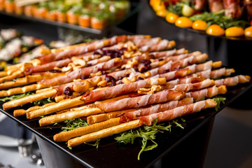 Bread sticks grissini with prosciutto