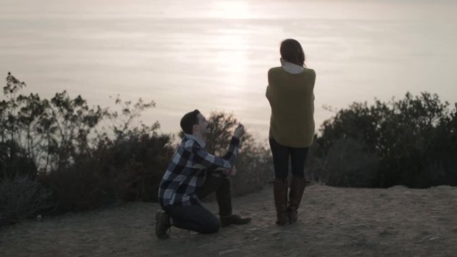 A Couple Gets Engaged Overlooking the Ocean at Sunset 09