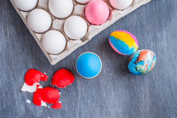 Egg red broken shell and cardboard box with white eggs