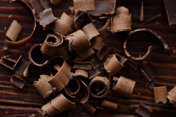 Delicious dark chocolate on a brown background 