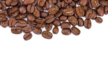 Closeup of coffee beans on white background. Copy space