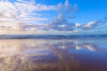 Acrylic prints Reflection Beautiful scene cloudy blue sky reflected on beach wet sand