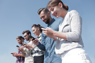young people using smartphones to search network