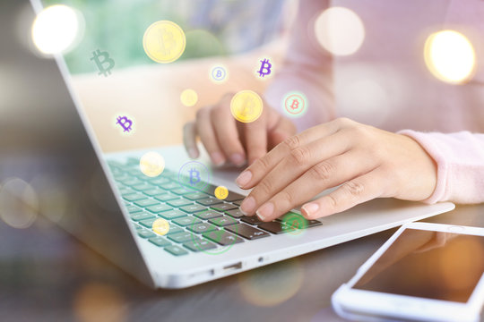 KIEV, UKRAINE - SEPTEMBER 25, 2017: Young woman with Apple MacBook Air at table, outdoors