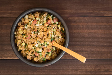 Chilean Pebre Salsa or Sauce made of Cochayuyo (lat. Durvillaea antarctica) or bull kelp edible seaweed, tomato, hot aji chili pepper, onion, garlic, parsley, photographed overhead with natural light