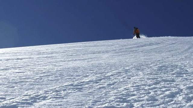 Skier sprays snow in British Columbia, slow motion