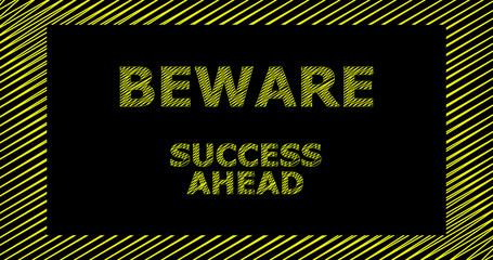 Beware success ahead sign; yellow letters on a black background.