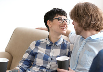 Cute young couple spending time together indoors