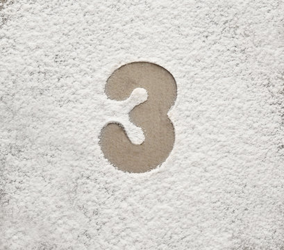 Silhouette of figure 3 on scattered flour