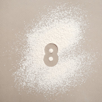 Silhouette of figure 8 on scattered flour
