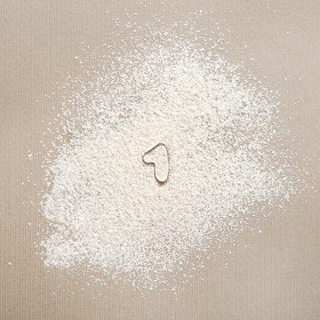 Silhouette of figure 1 on scattered flour