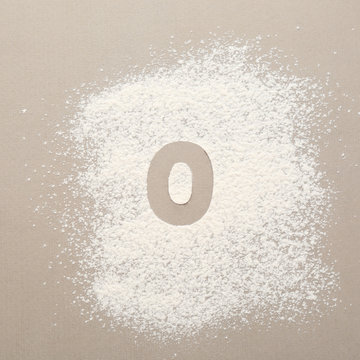 Silhouette of figure 0 on scattered flour