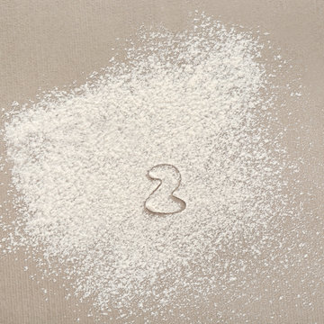 Silhouette of figure 2 on scattered flour