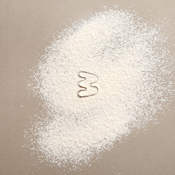 Silhouette of figure 3 on scattered flour