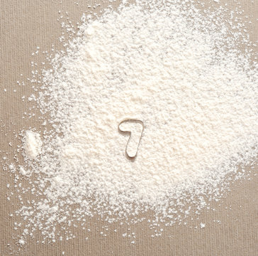 Silhouette of figure 7 on scattered flour