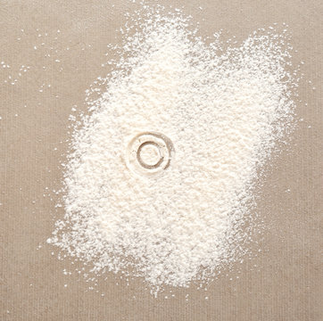 Silhouette of figure 0 on scattered flour