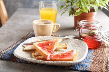 Delicious toasts with sweet jam on plate