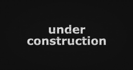 Under construction word on grey background.