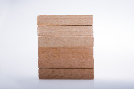 Wooden domino blocks on white background