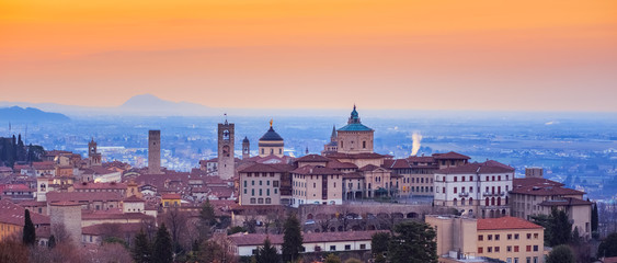 Bergamo Old Town, Lombardy, Italy, in red sunrise light - obrazy, fototapety, plakaty