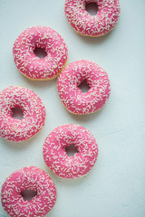 Donut. Sweet icing sugar food. Dessert colorful snack. Glazed sprinkles. Treat from delicious pastry breakfast. Bakery cake. Doughnut with frosting. Baked unhealthy round. Top view