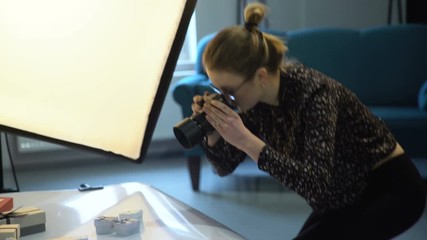 backstage photography. teamwork ideas brainstorming. photographer camera equipment and technology. photoshoot in process - Powered by Adobe