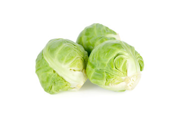 uncooked Brussel sprouts on white background