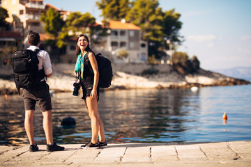 Young freelancing photographers traveling and backpacking.Experiencing different...
