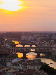 Obraz premium Panorama, aerial view, River Arno and Ponte Vecchio (Old Bridge), during the sunset, Florence, Tuscany, Italy.