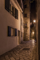 Fototapeta na wymiar Night streets and buildings of the old town of Kotor. Montenegro.