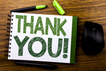 Handwriting Announcement text showing Thank You. Business concept for Thanks Message written on notebook book note paper on the wooden background. Green word letters. Next to mouse.