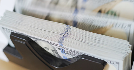 Counting money banknote of US dollar