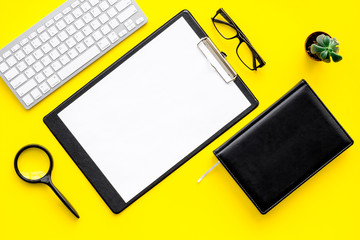 Strict work desk of accutate person and productive worker. Geometrical pattern. Yellow background top view mockup