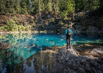 Woman Stands Over Blue Pool